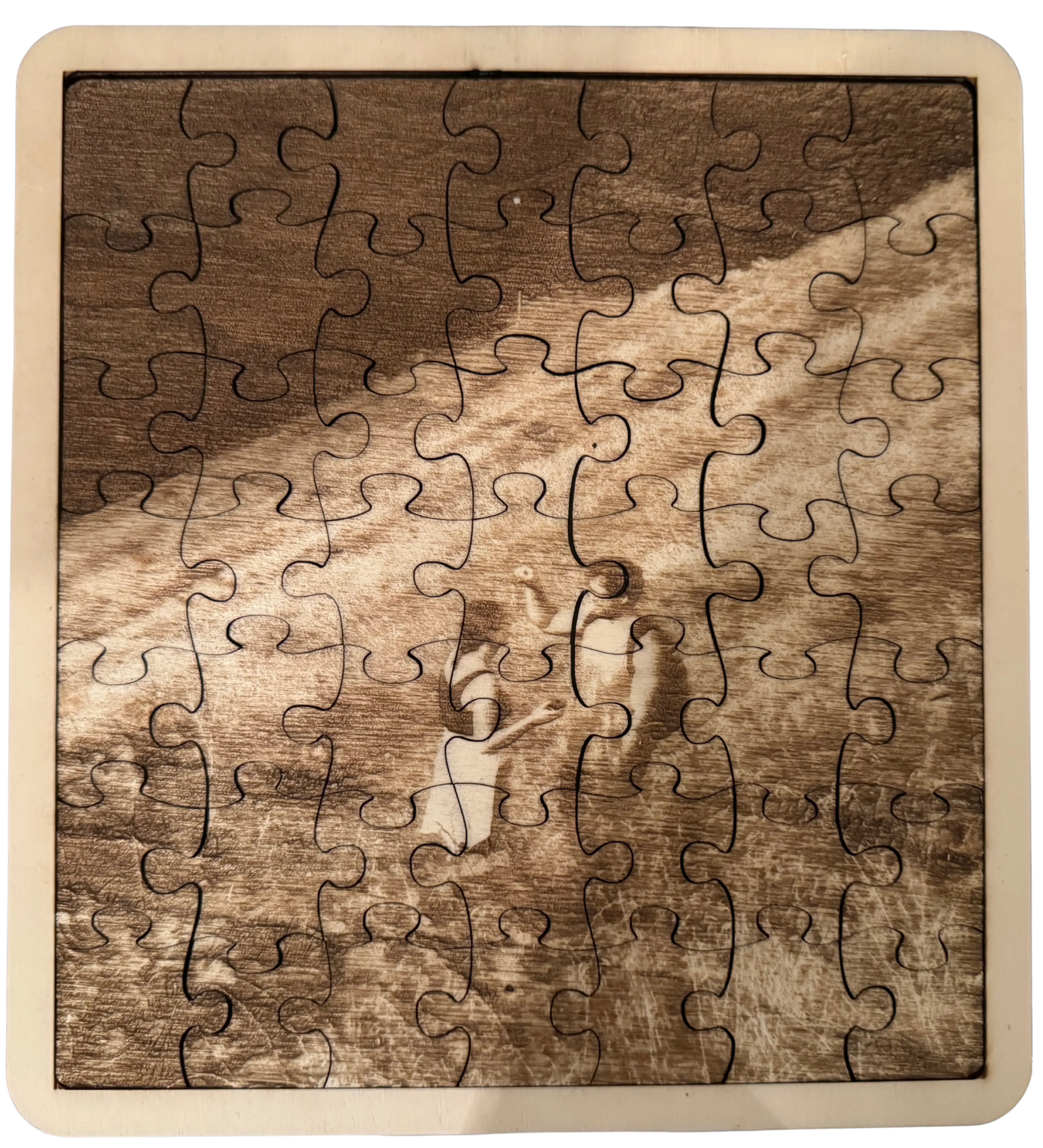 Holzpuzzel mit Rahmen aus garviertem Foto
